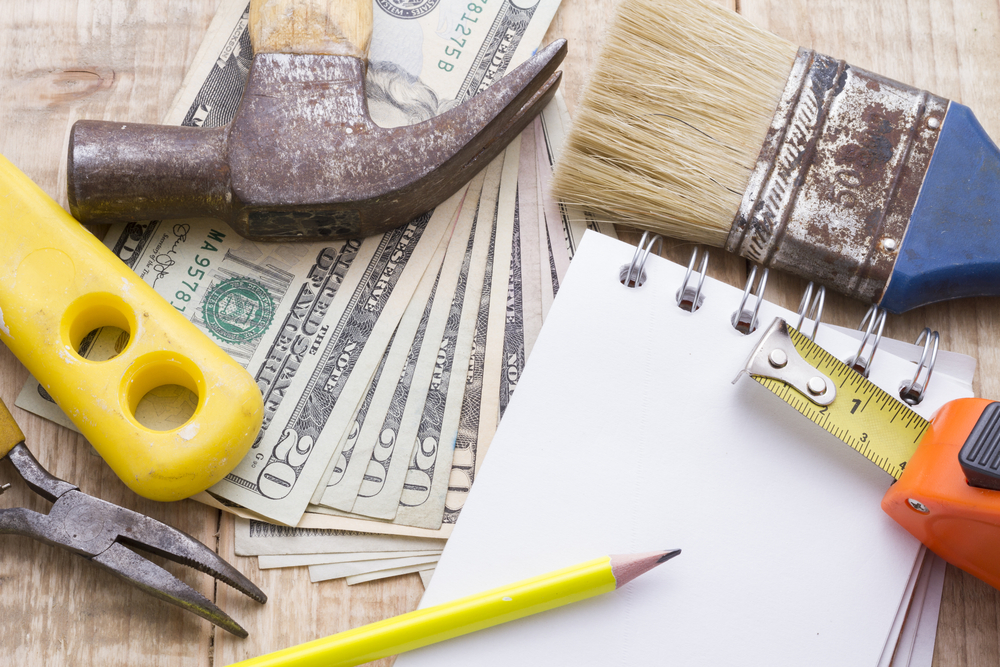 Notebook,,calculator,,and,tools,on,wooden,background,to,make,a